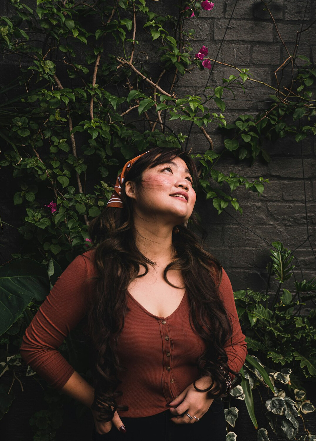 Studio portrait of a Hispanic woman editor smiling