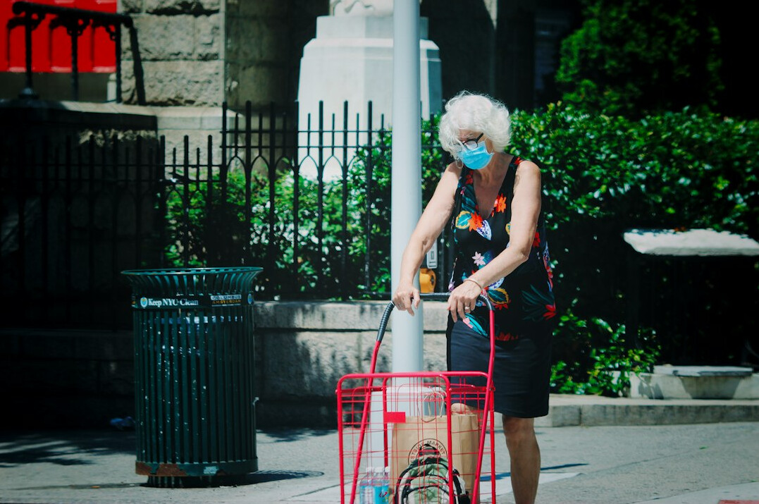 elderly person shopping cart