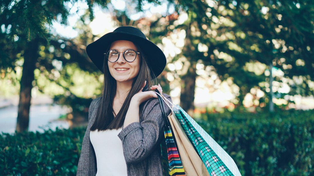 woman hiding items in bag
