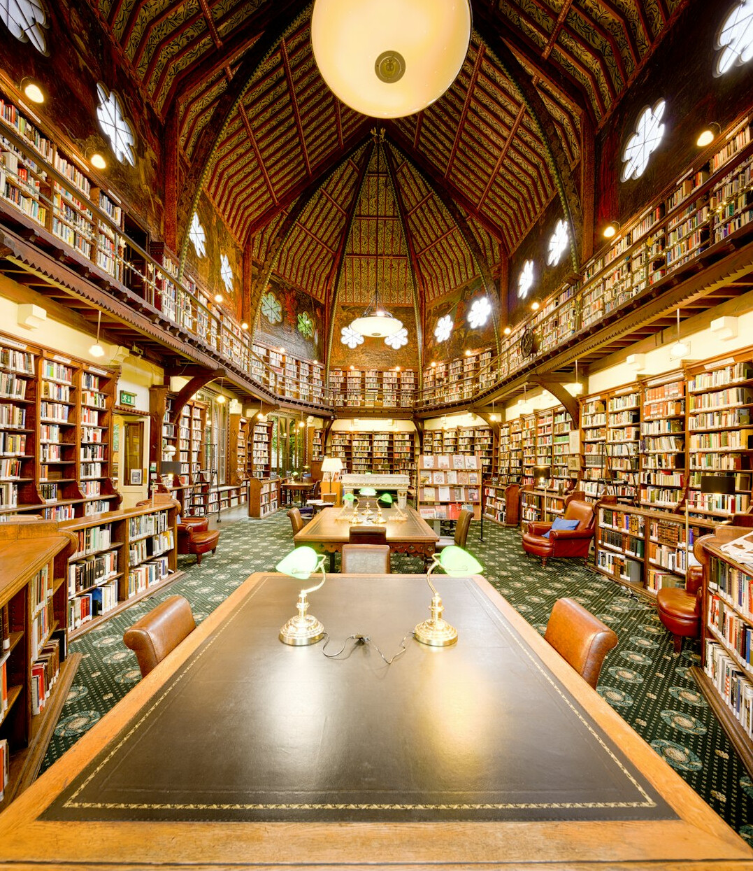 Historic library reading room with tall wooden bookshelves